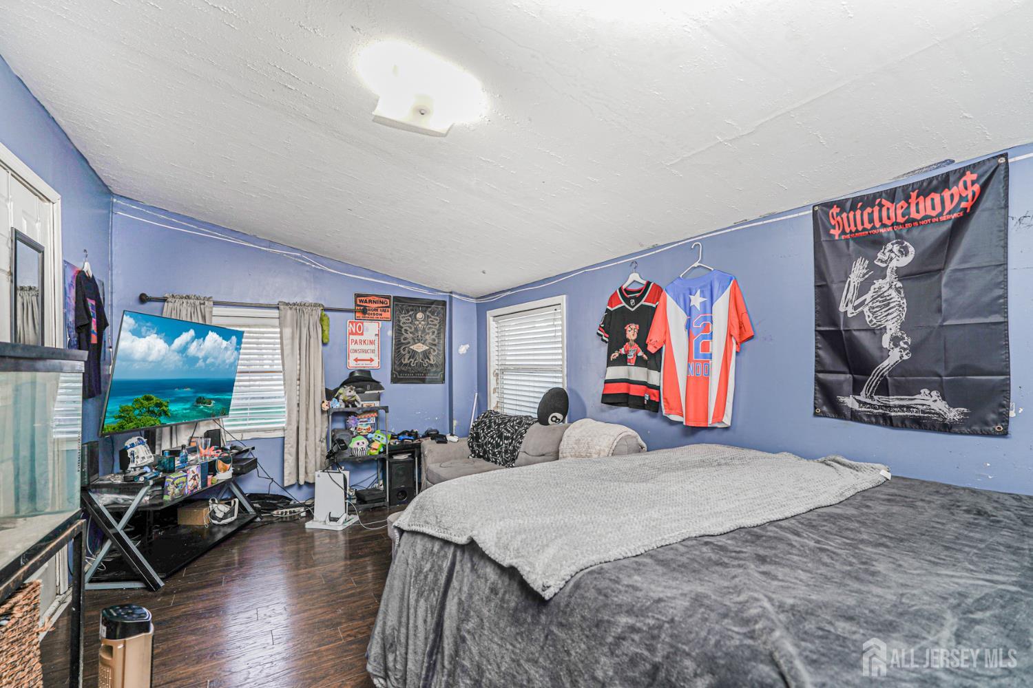 7 Walnut Lane Parlin, NJ 08859 - Photo 16 of 22 a bedroom with a bed and a flat screen tv