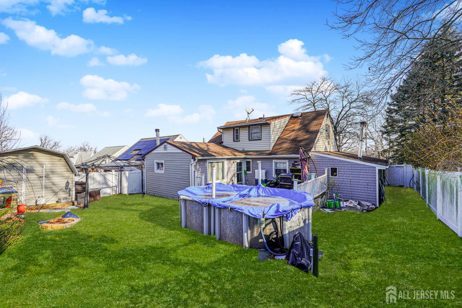 7 Walnut Lane Parlin, NJ 08859 - Photo 20 of 22 a view of a house with a big yard potted plants and large tree