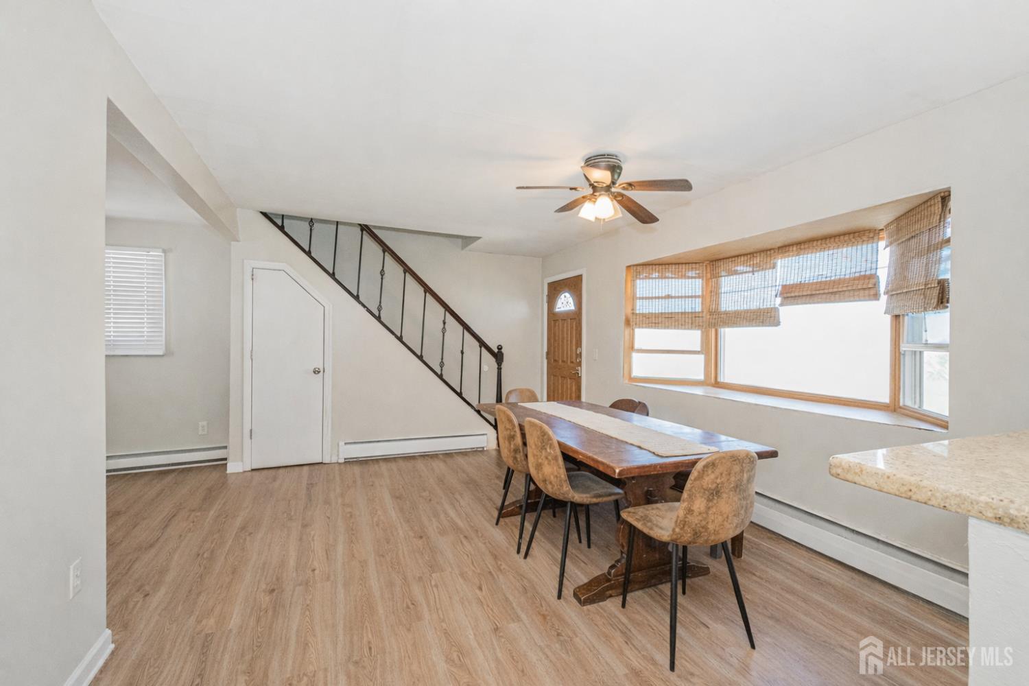 7 Walnut Lane Parlin, NJ 08859 - Photo 21 of 22 a view of a dining room with furniture window and wooden floor