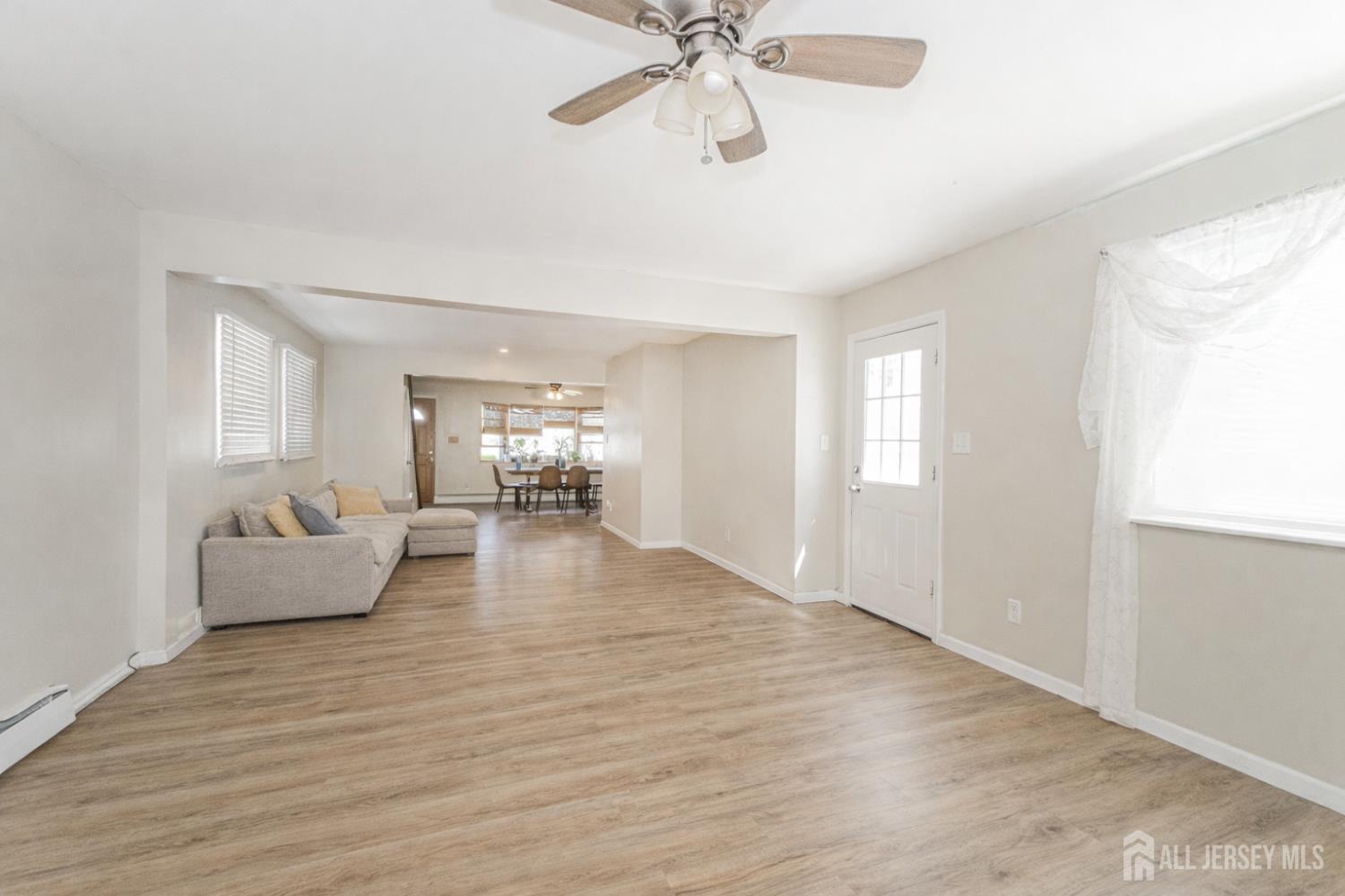 7 Walnut Lane Parlin, NJ 08859 - Photo 22 of 22 a view of a livingroom with furniture ceiling fan and hardwood floor