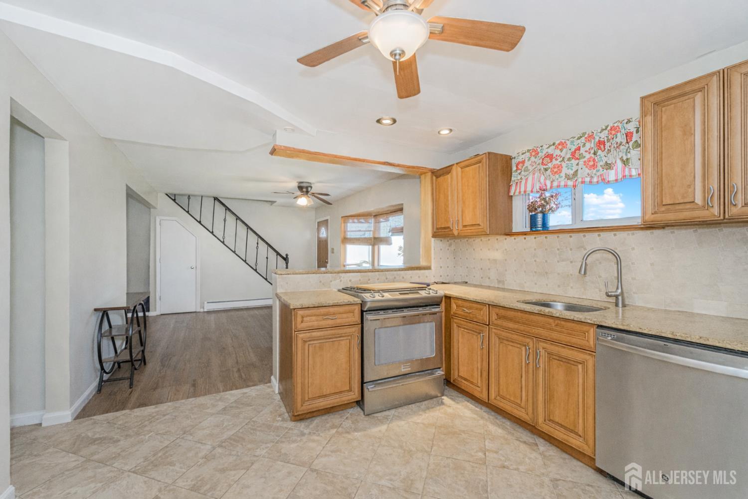 7 Walnut Lane Parlin, NJ 08859 - Photo 3 of 22 a kitchen with sink cabinets and window