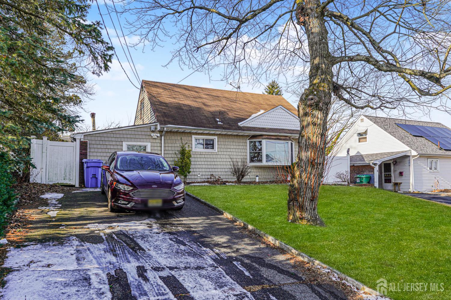 7 Walnut Lane Parlin, NJ 08859 - Photo 3 of 23 a view of house with backyard and outdoor seating