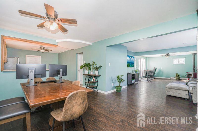 7 Walnut Lane Parlin, NJ 08859 - Photo 4 of 23 a view of a dining room with furniture and wooden floor