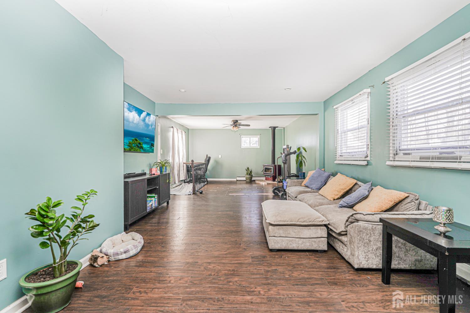 7 Walnut Lane Parlin, NJ 08859 - Photo 7 of 23 a living room with furniture and a potted plant