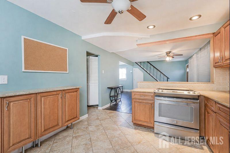 7 Walnut Lane Parlin, NJ 08859 - Photo 10 of 23 a kitchen with a stove and a sink