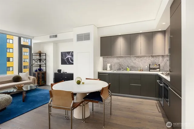 a kitchen with a table and chairs in it