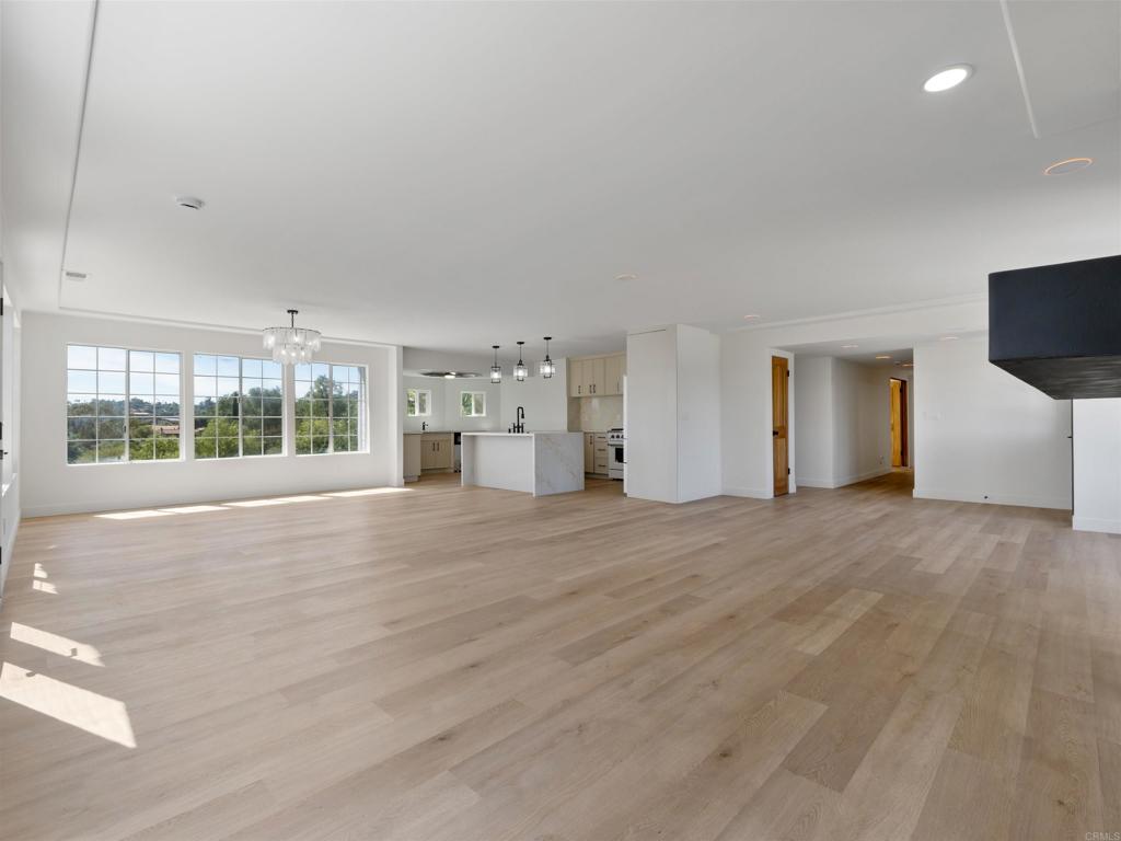 28148 Mountain Meadow Road Escondido, CA 92026 - Photo 14 of 51 a view of an empty room with a window and a kitchen