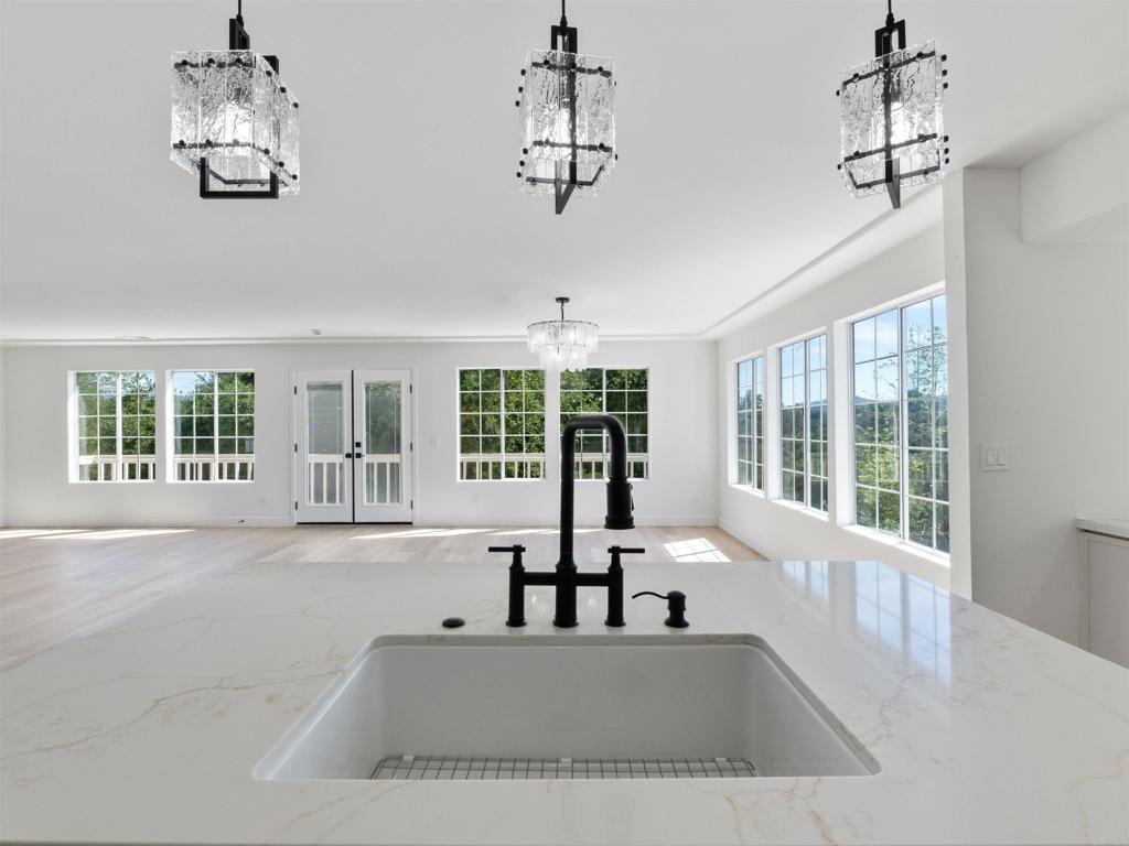 28148 Mountain Meadow Road Escondido, CA 92026 - Photo 21 of 51 a view of a living room and chandelier