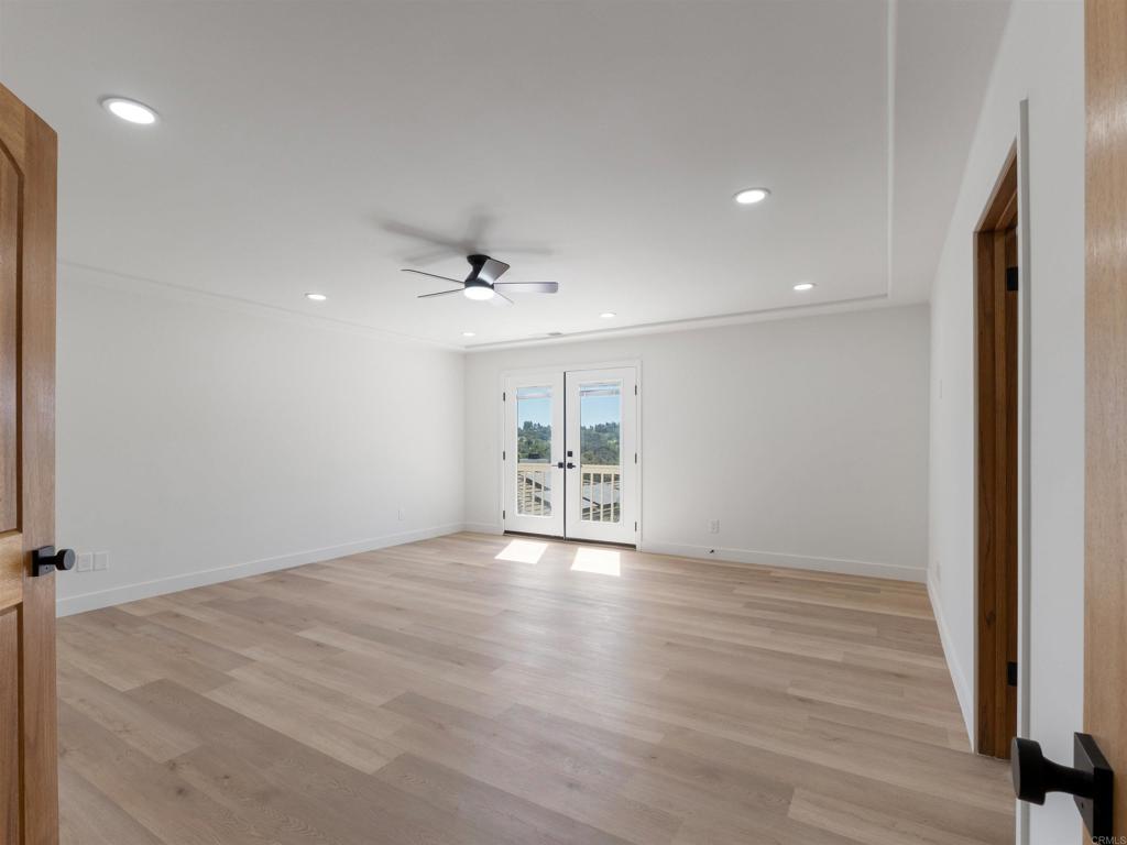 28148 Mountain Meadow Road Escondido, CA 92026 - Photo 22 of 51 wooden floor in an empty room with a window
