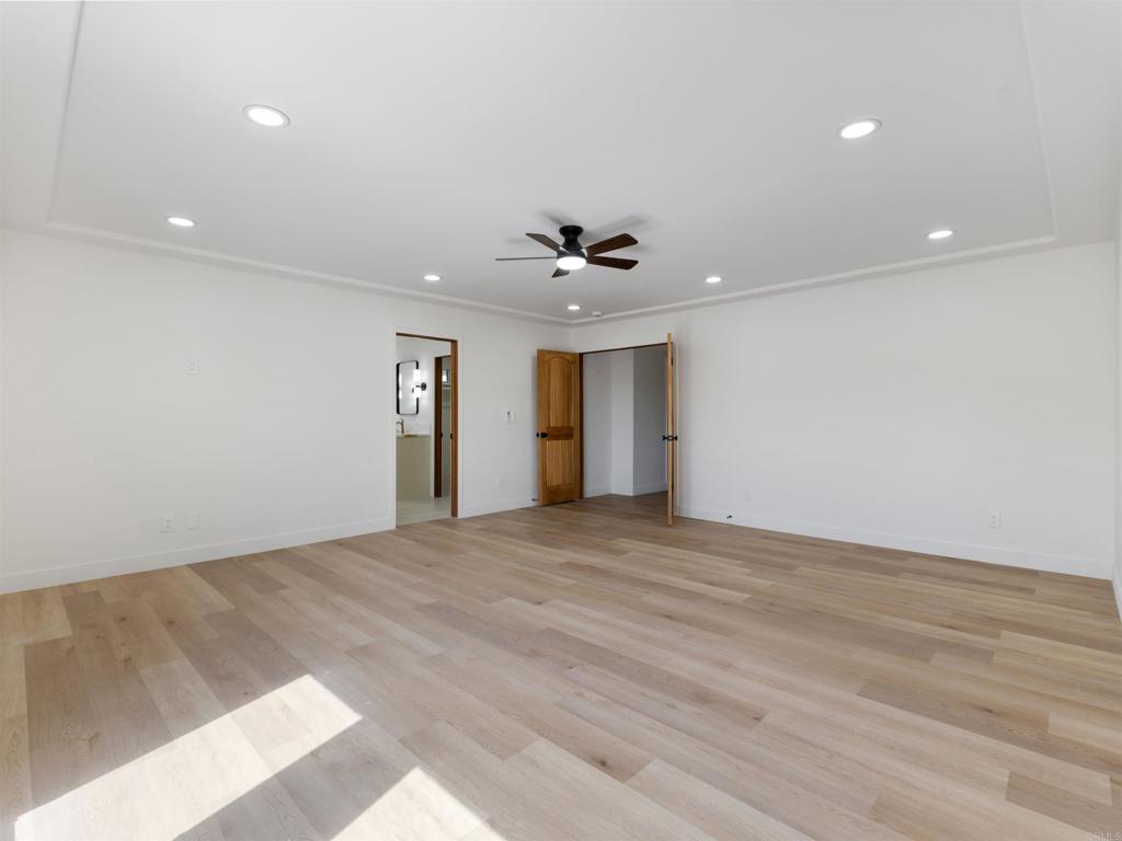 28148 Mountain Meadow Road Escondido, CA 92026 - Photo 25 of 51 a view of an empty room with a ceiling fan