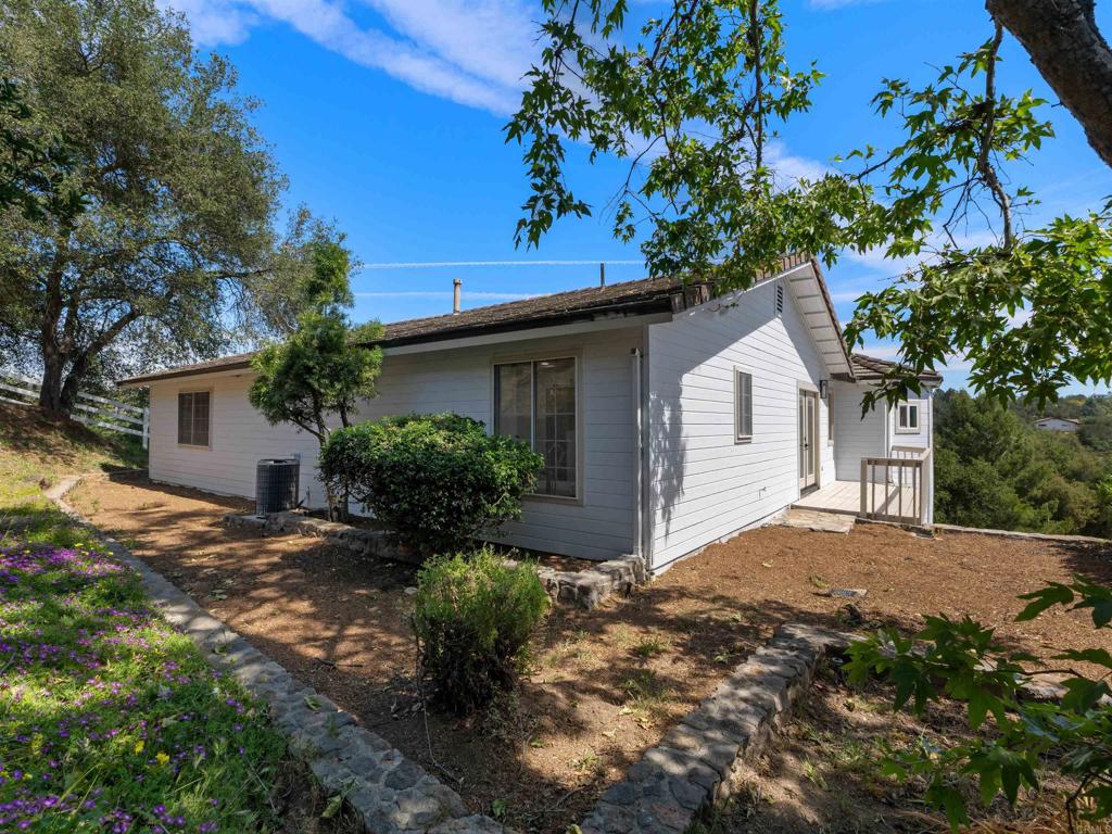 28148 Mountain Meadow Road Escondido, CA 92026 - Photo 42 of 51 a view of a house with a yard