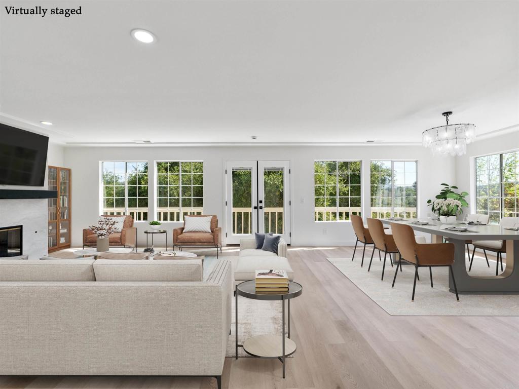 28148 Mountain Meadow Road Escondido, CA 92026 - Photo 10 of 51 a living room with furniture a fireplace and a flat screen tv