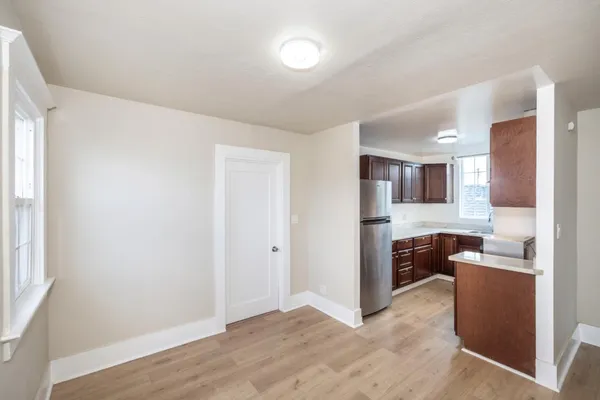 a view of a kitchen with a refrigerator a sink and dishwasher
