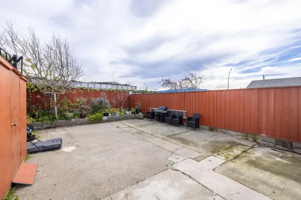 a view of a outdoor space with wooden fence
