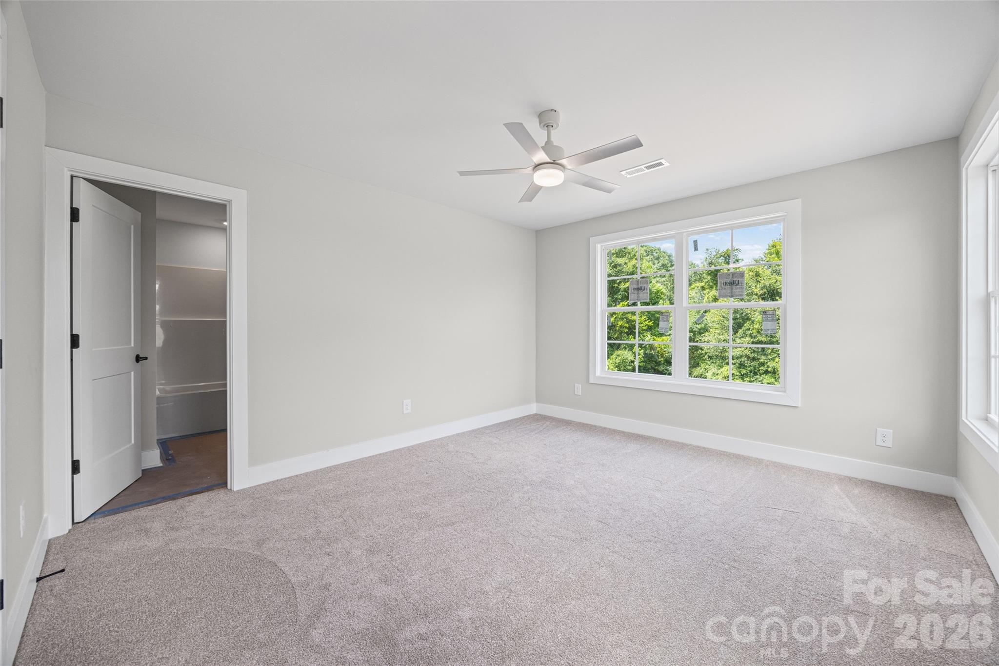 640 Edwards Road Fort Lawn, SC 29714 - Photo 26 of 39 an empty room with a ceiling fan and a window