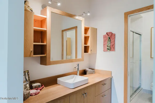 a bathroom with a sink and a mirror
