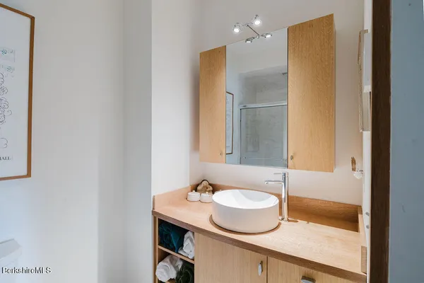 a bathroom with a sink and a mirror