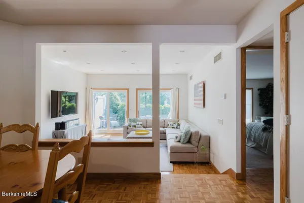 a living room with furniture and large windows
