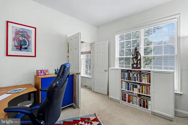 a view of a workspace with furniture and toys