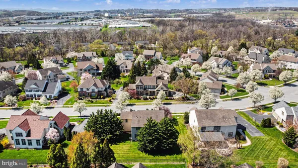 an aerial view of residential houses with outdoor space