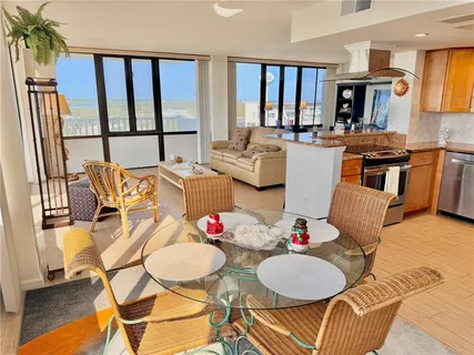 a bedroom with a large bed and a large window