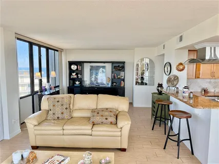 a view of a living room with a large window
