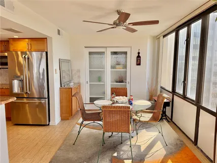 a view of a hallway view with wooden floor and furniture