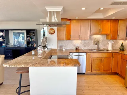 a living room with furniture and large windows