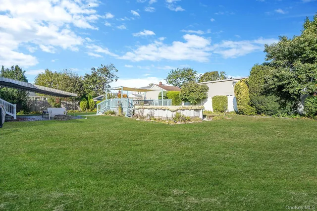 a view of house with outdoor space and garden