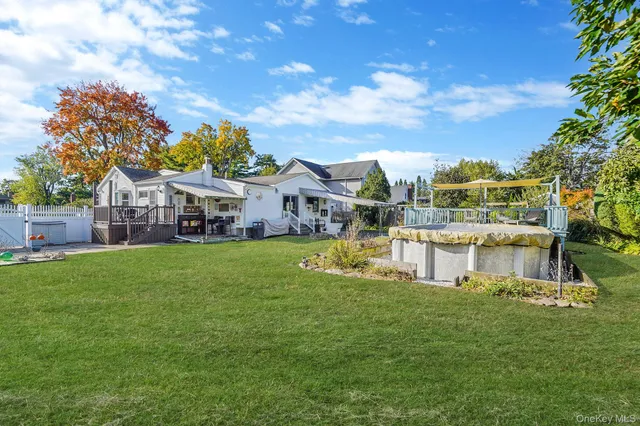 a view of house with a garden