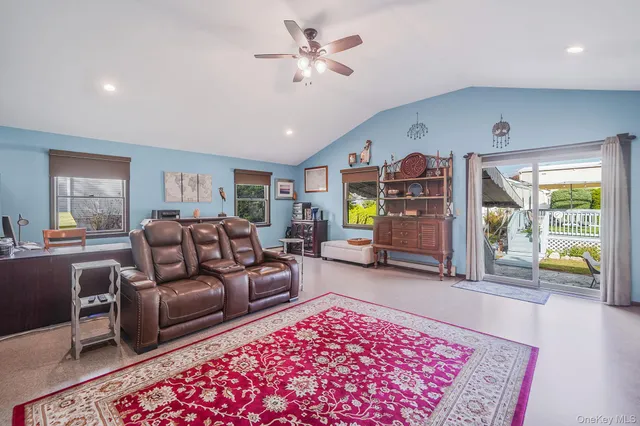 a living room with furniture and a rug