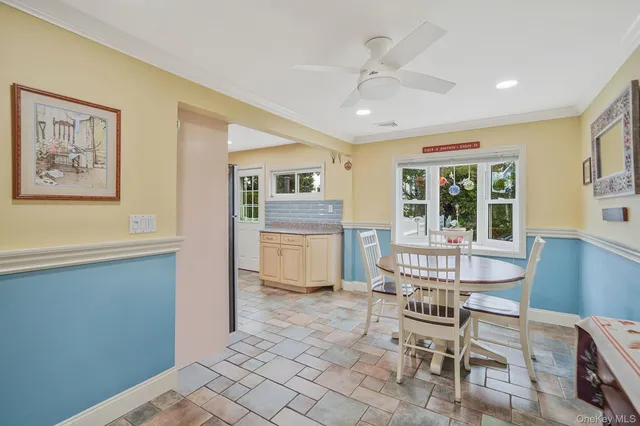 a dining room with furniture and window