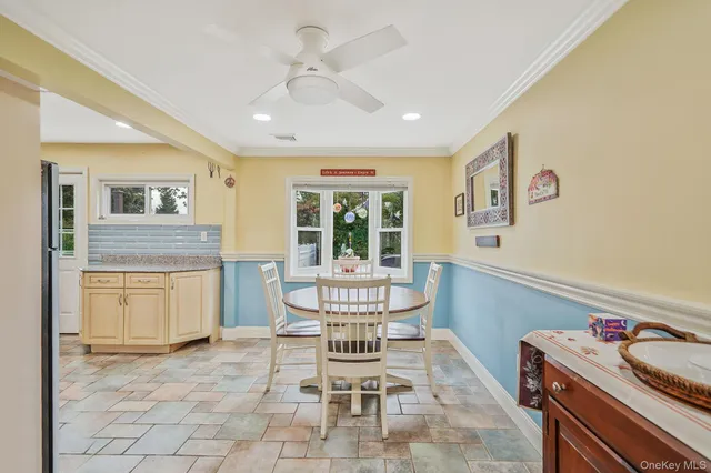 a view of a dining room with furniture window and outside view