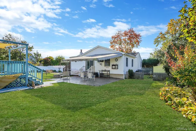 a view of a house with a yard porch and sitting area
