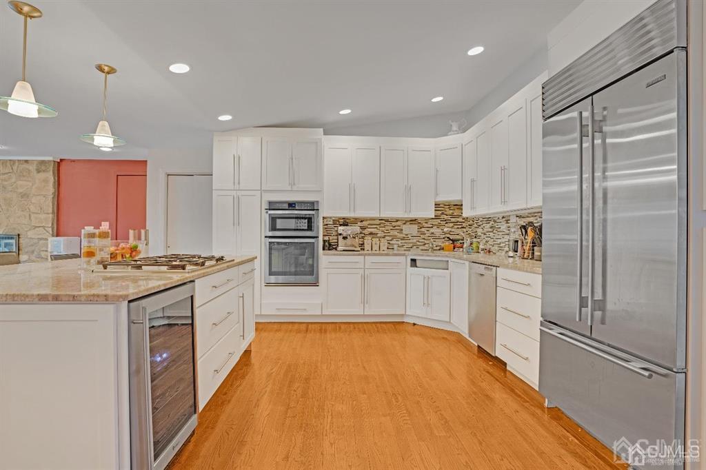 3 Clive Hills Road Edison, NJ 08820 - Photo 11 of 39 a kitchen with stainless steel appliances granite countertop a refrigerator sink and white cabinets