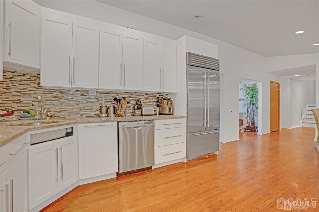 3 Clive Hills Road Edison, NJ 08820 - Photo 12 of 39 a kitchen with granite countertop white cabinets and stainless steel appliances