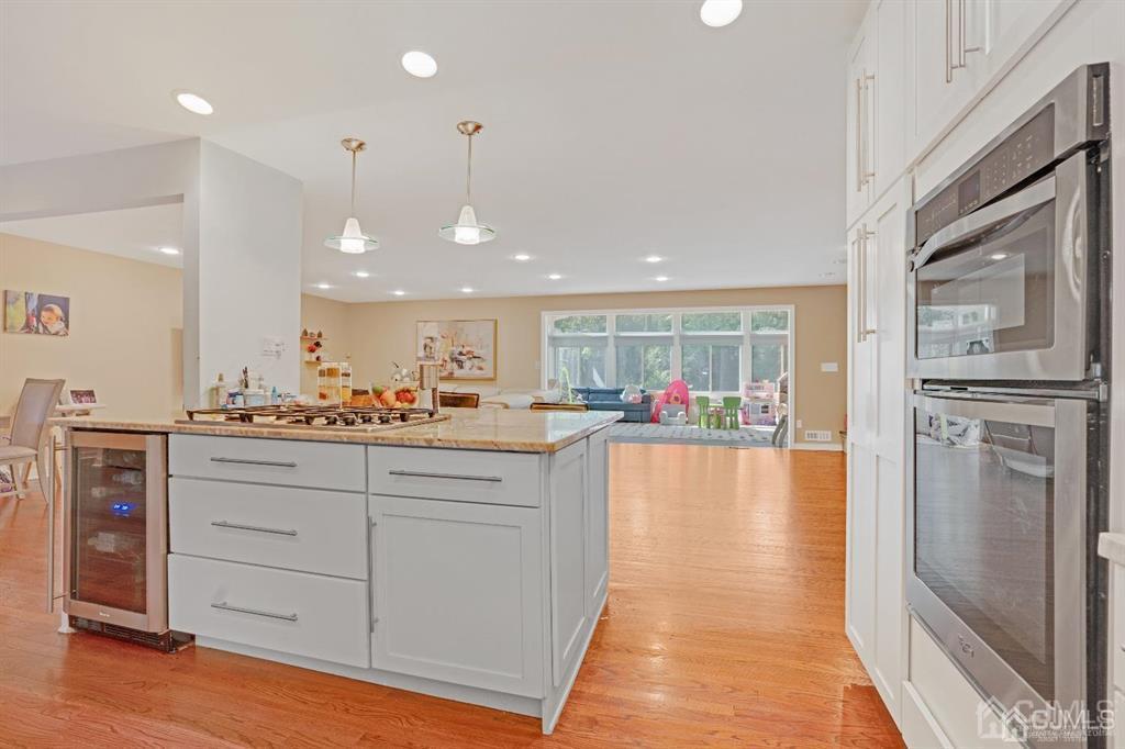 3 Clive Hills Road Edison, NJ 08820 - Photo 13 of 39 a view of a kitchen with kitchen island a counter top space cabinets and stainless steel appliances