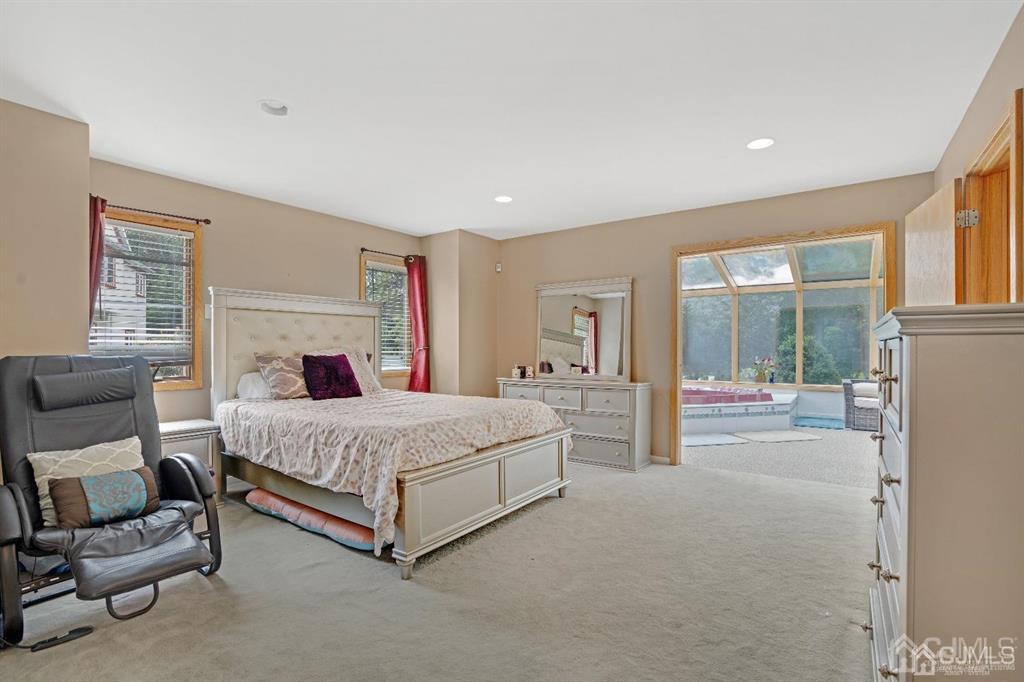 3 Clive Hills Road Edison, NJ 08820 - Photo 19 of 39 a spacious bedroom with a bed and glass door