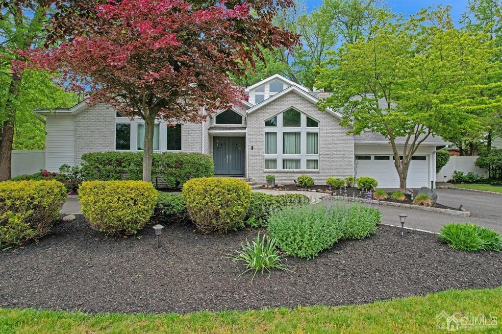 3 Clive Hills Road Edison, NJ 08820 - Photo 2 of 39 a front view of a house with garden