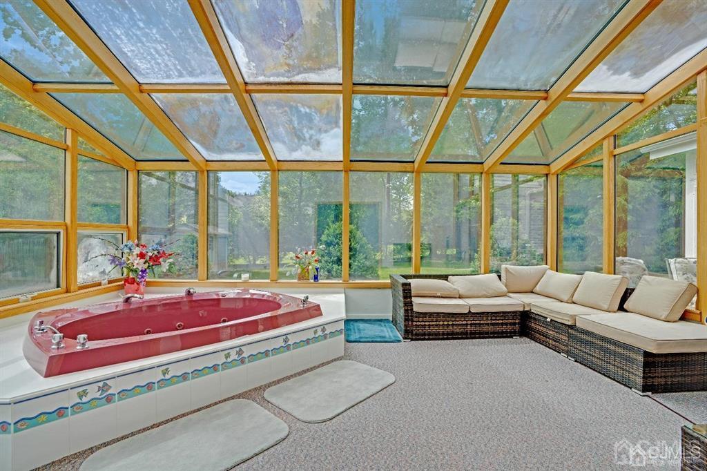 3 Clive Hills Road Edison, NJ 08820 - Photo 23 of 39 a living room with furniture and floor to ceiling windows