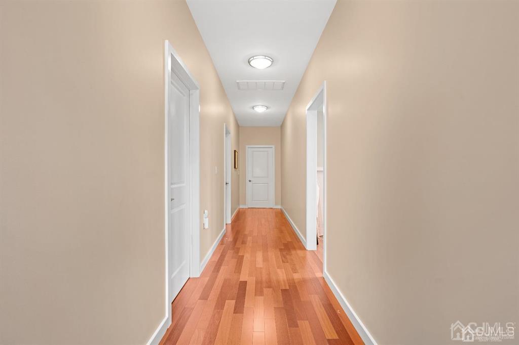 3 Clive Hills Road Edison, NJ 08820 - Photo 26 of 39 a view of a hallway with wooden floor