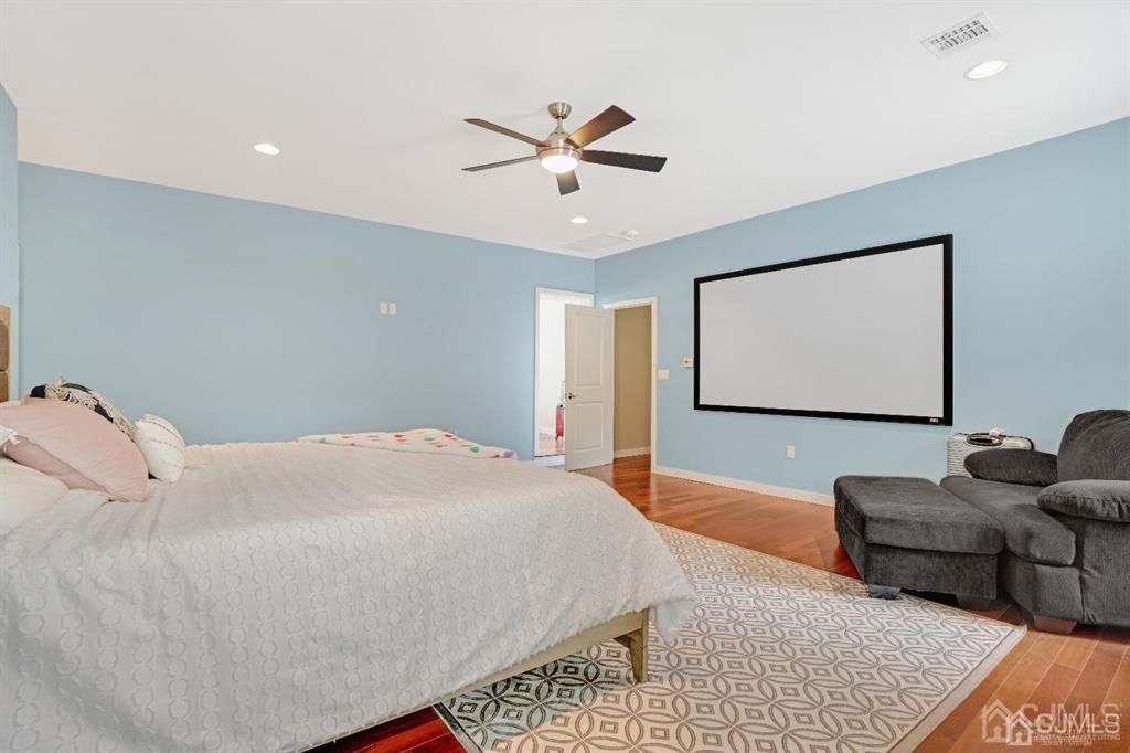 3 Clive Hills Road Edison, NJ 08820 - Photo 28 of 39 a bedroom with a bed couch and window