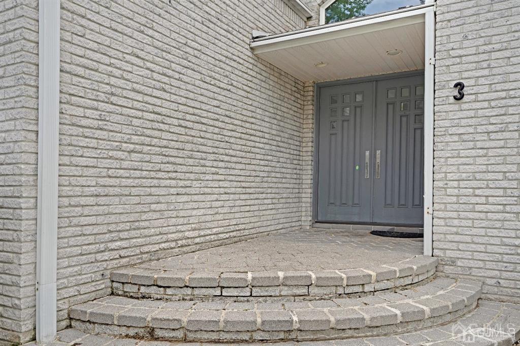 3 Clive Hills Road Edison, NJ 08820 - Photo 3 of 39 a view of a door of the house