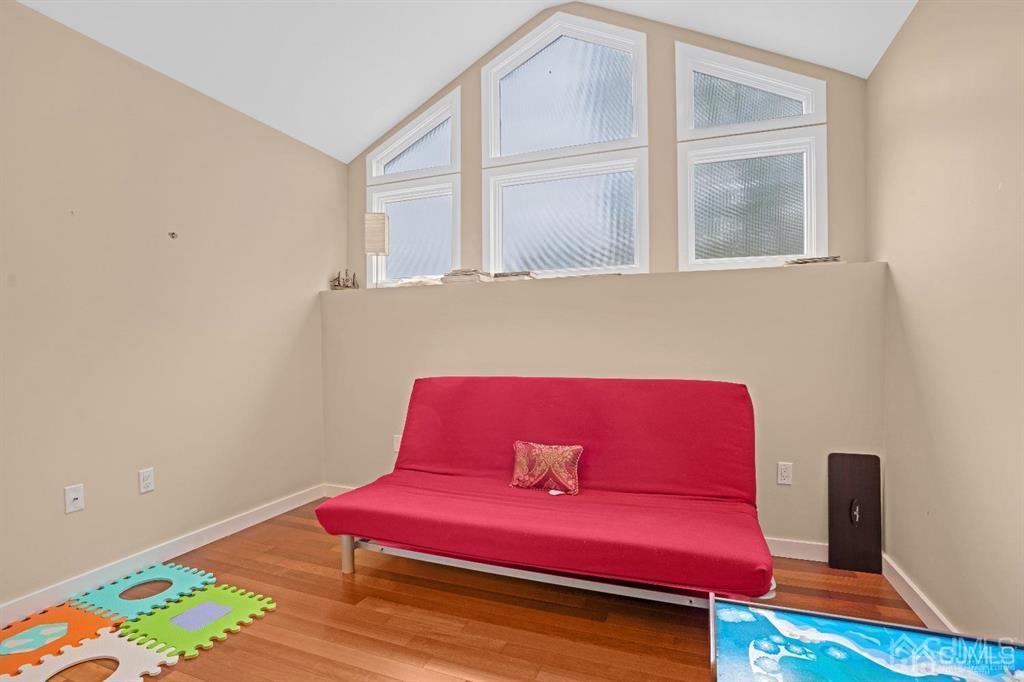 3 Clive Hills Road Edison, NJ 08820 - Photo 32 of 39 a living room with furniture and a wooden floor