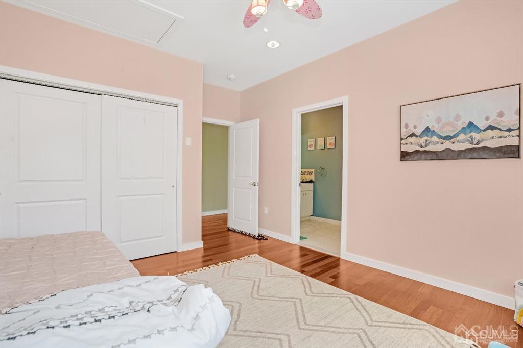 3 Clive Hills Road Edison, NJ 08820 - Photo 36 of 39 a bedroom with a bed and a painting on the wall