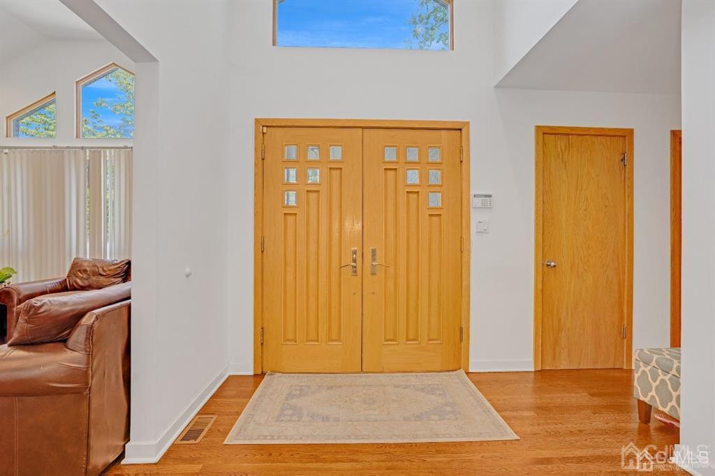 3 Clive Hills Road Edison, NJ 08820 - Photo 4 of 39 a view of a livingroom with furniture wooden floor and window