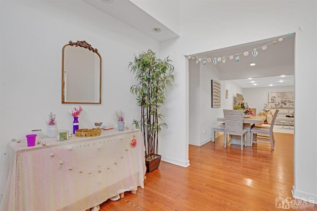 3 Clive Hills Road Edison, NJ 08820 - Photo 5 of 39 a view of a dining room with furniture and a mirror