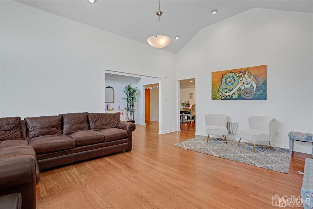 3 Clive Hills Road Edison, NJ 08820 - Photo 7 of 39 a living room with furniture and a wooden floor