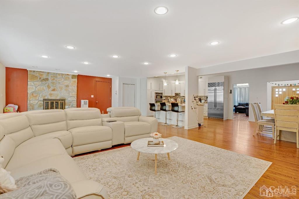 3 Clive Hills Road Edison, NJ 08820 - Photo 9 of 39 a living room with furniture and view of kitchen