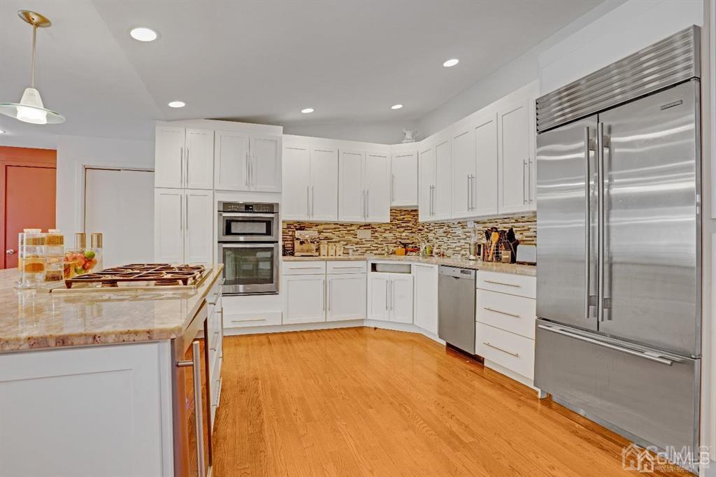 3 Clive Hills Road Edison, NJ 08820 - Photo 10 of 39 a kitchen with stainless steel appliances granite countertop a refrigerator sink and white cabinets